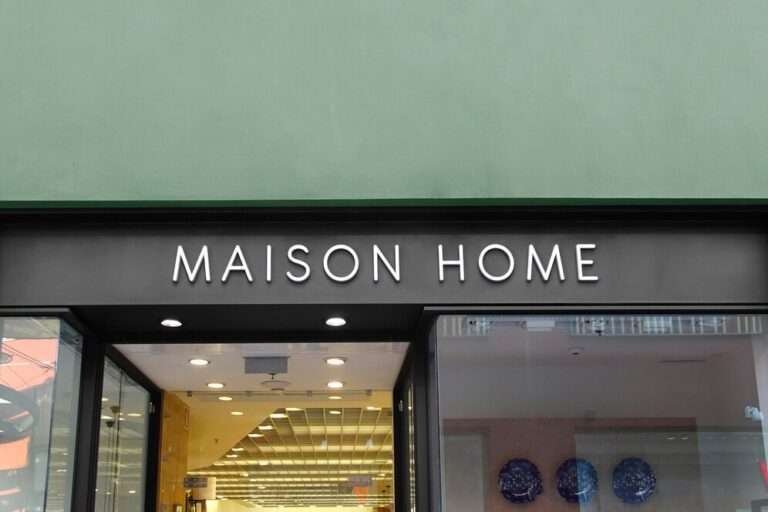 Slim white flat-cut letters on a shopfront