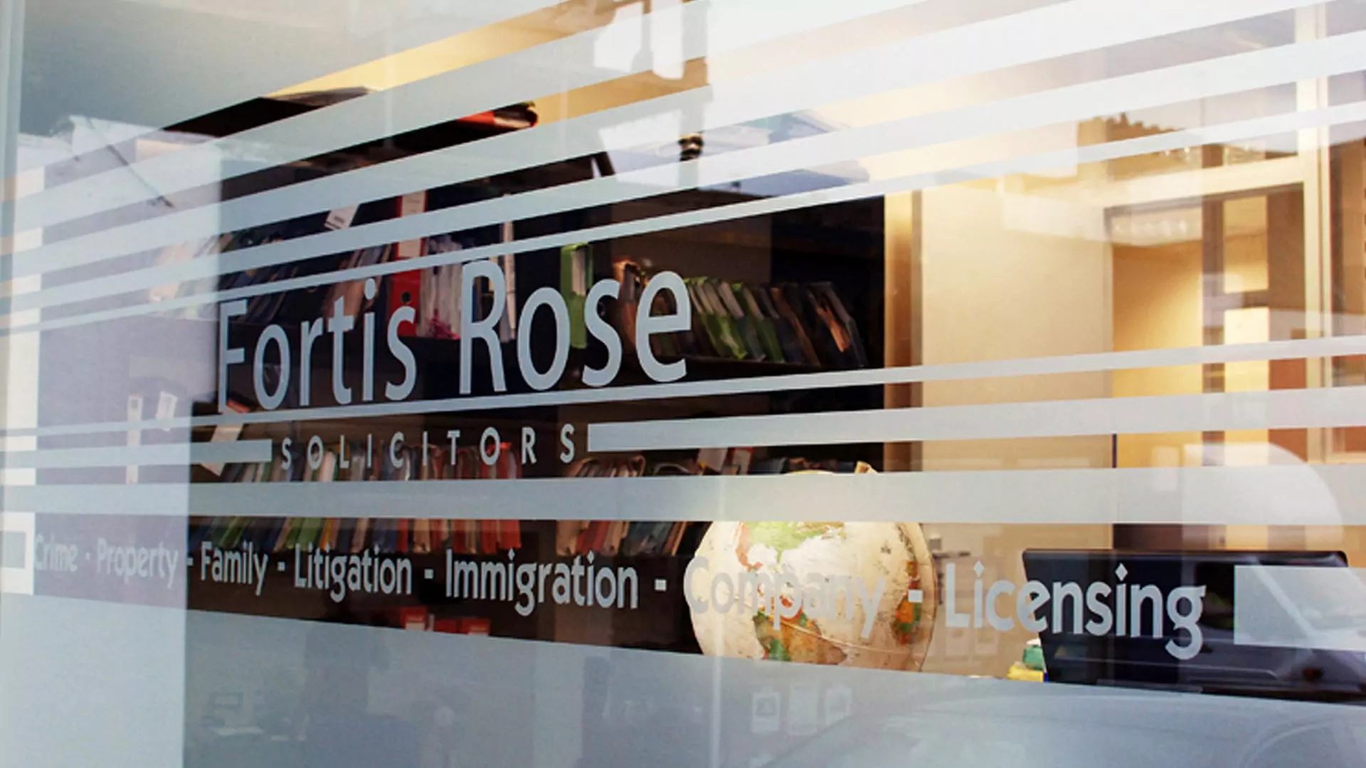 Printed graphics applied to a business window