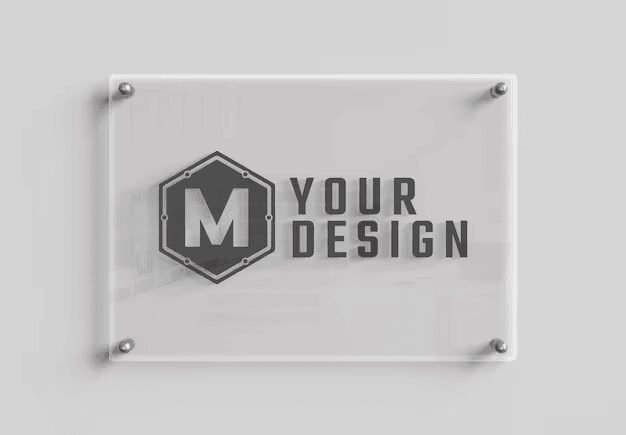 Clear acrylic reception sign mounted on a white wall