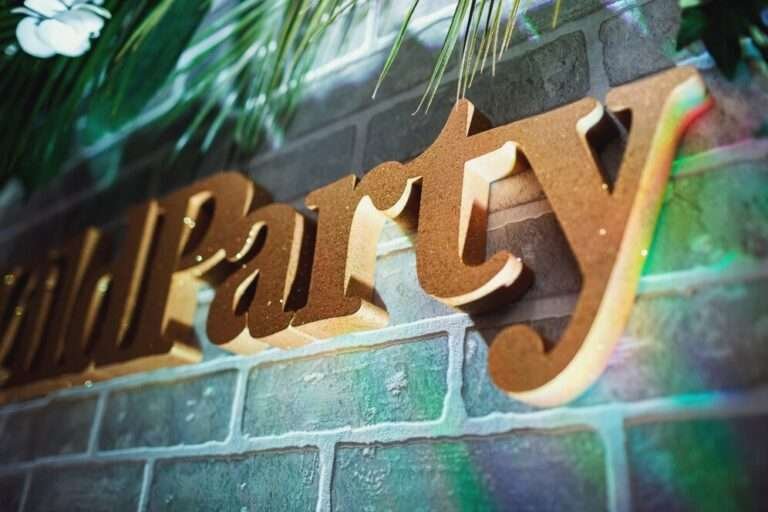 Warm wood-look dimensional letters on a brick wall