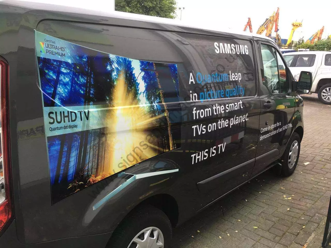 Commercial van with branded vehicle graphics